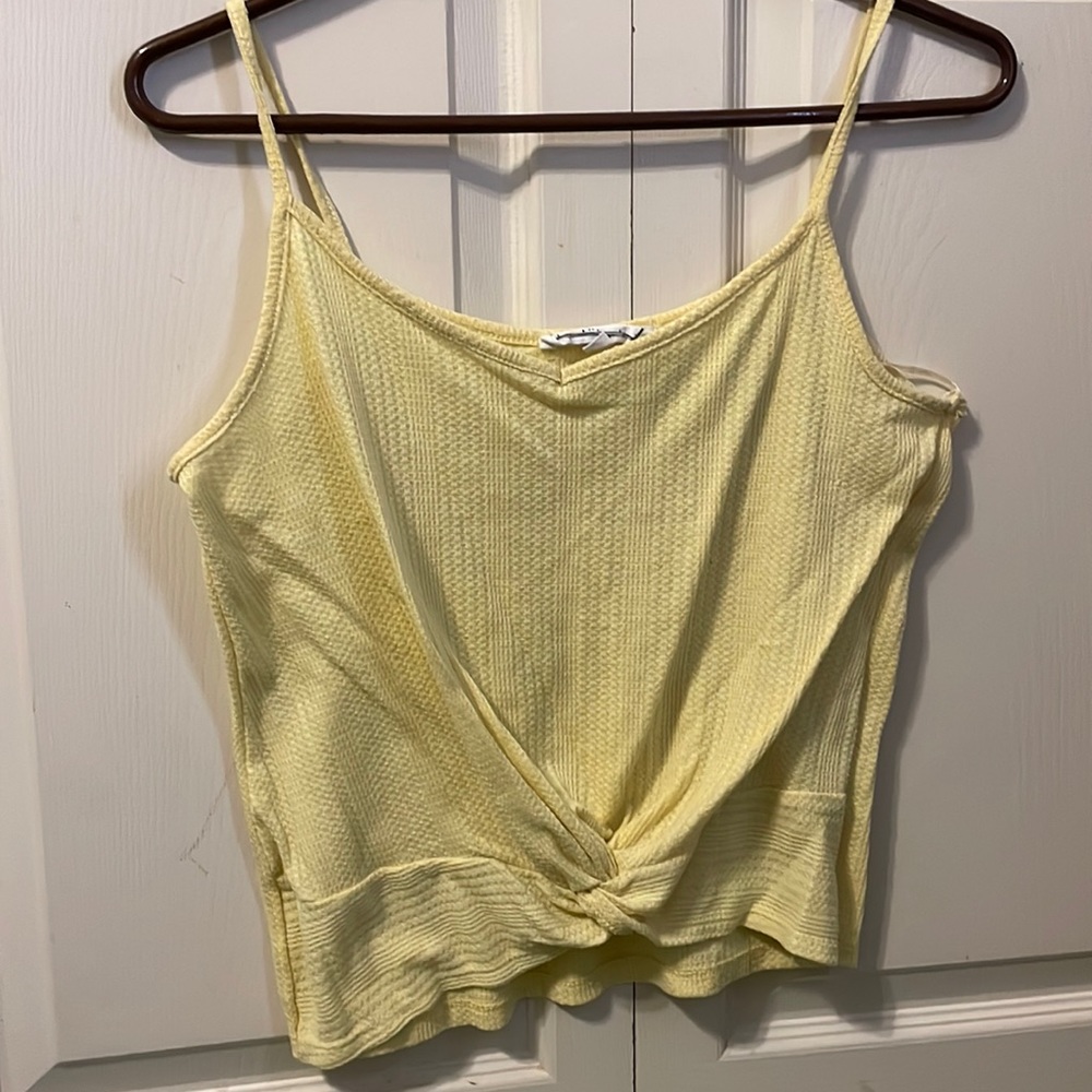 tied yellow tank!